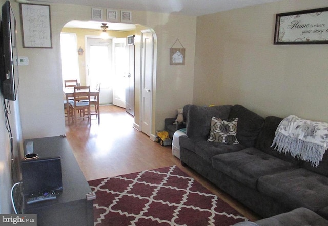 3642 Clarenell Rd, Baltimore, MD 21229 - living room with arched walkways and wood finished floors