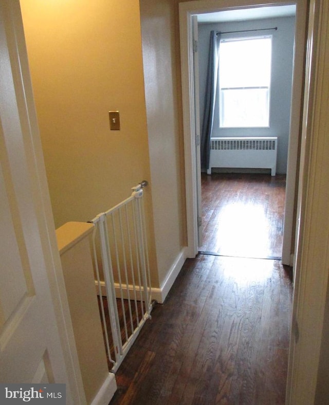3642 Clarenell Rd, Baltimore, MD 21229 - hallway with radiator and wood finished floors
