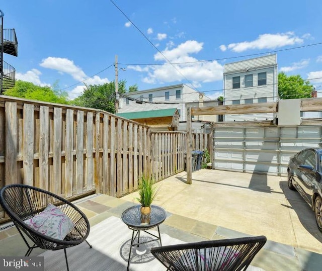1817 6th St NW Unit A, Washington, DC 20001 - fenced backyard with a garage and a patio