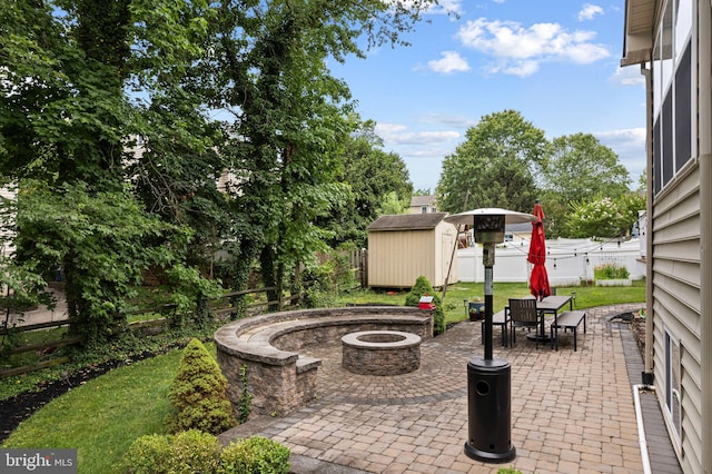 420 E Cottage Ave, Haddonfield, NJ 08033 - fenced backyard with a fire pit, a storage shed, a patio area, and outdoor dining area