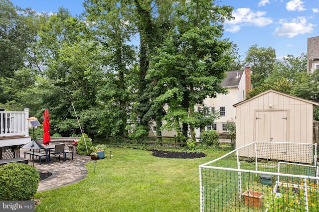420 E Cottage Ave, Haddonfield, NJ 08033 - view of yard with a vegetable garden, a storage unit, and a patio area