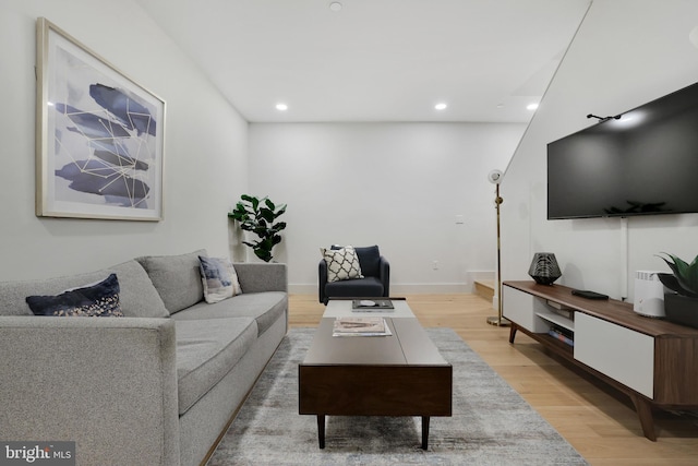 1309 SE E St SE Unit 27, Washington, DC 20003 - living room with light wood-style floors and recessed lighting