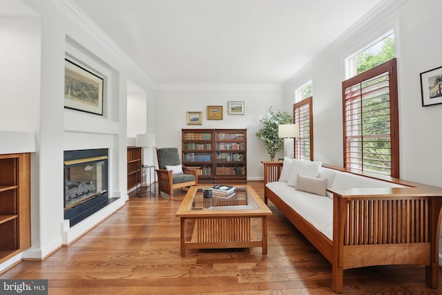 2119 21st Rd N, Arlington, VA 22201 - living room featuring a glass covered fireplace, ornamental molding, wood finished floors, and built in shelves