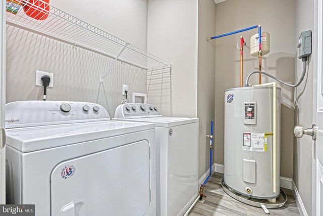 910 Cavalry St, Carlisle, PA 17013 - laundry room featuring electric water heater, washer and clothes dryer, and light wood finished floors