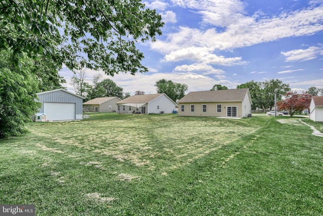 910 Cavalry St, Carlisle, PA 17013 - view of grassy yard with a detached garage and an outdoor structure