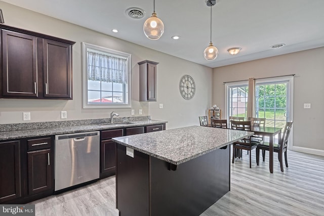 910 Cavalry St, Carlisle, PA 17013 - kitchen featuring dishwasher, light wood finished floors, dark brown cabinets, a center island, and decorative light fixtures