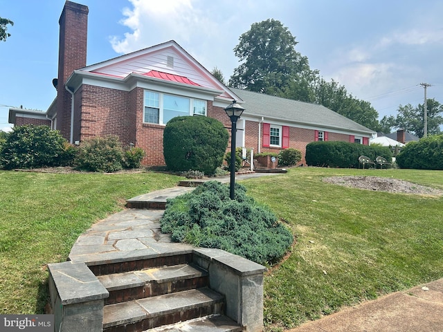 503 Macoy Ave, Culpeper, VA 22701 - view of front of house with brick siding, a chimney, and a front yard