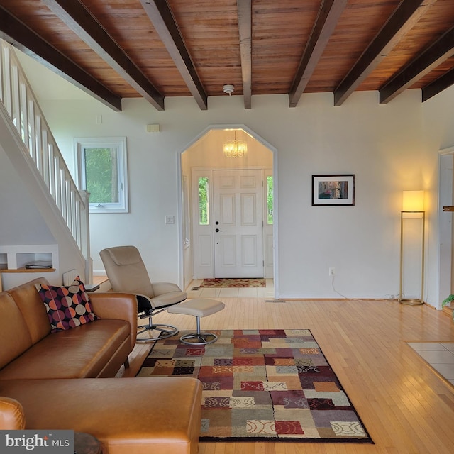 4715 Oak Rd, Shady Side, MD 20764 - living area featuring wood-type flooring, a chandelier, stairs, and a wood ceiling with exposed beams