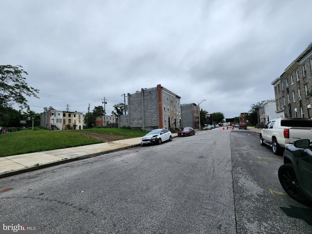 1841 Mchenry St, Baltimore, MD 21223 - view of asphalt road featuring sidewalks, street lighting, curbs, and a residential view