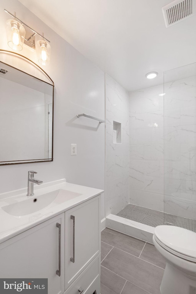 8281 Clifton Farm Ct, Alexandria, VA 22306 - bathroom with vanity, a marble finish shower, and recessed lighting