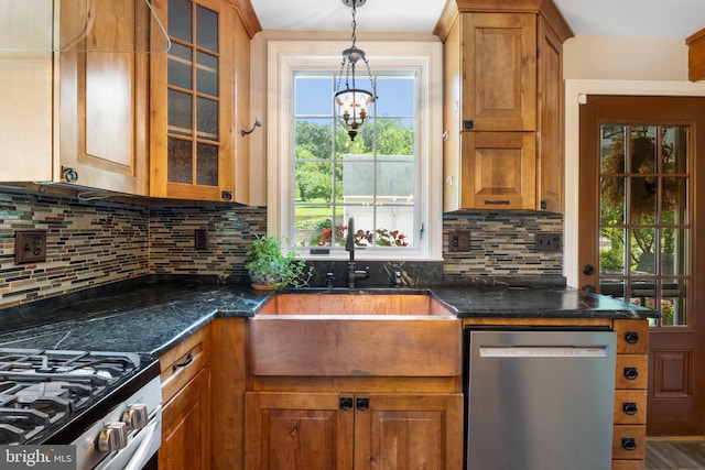 3834 Druck Valley Rd, York, PA 17406 - kitchen with stainless steel dishwasher, a chandelier, brown cabinets, and plenty of natural light