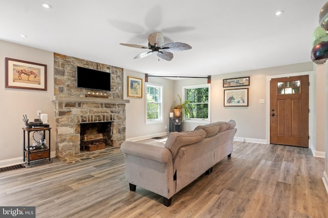 3834 Druck Valley Rd, York, PA 17406 - living room with wood finished floors, a stone fireplace, a ceiling fan, and recessed lighting