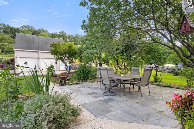 3834 Druck Valley Rd, York, PA 17406 - view of patio with outdoor dining area and a garage