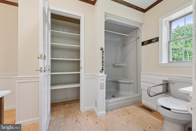 249 Mattson Rd, Garnet Valley, PA 19060 - full bathroom with a stall shower, wainscoting, wood finished floors, crown molding, and a closet