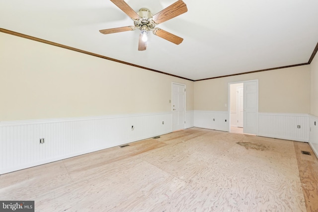 249 Mattson Rd, Garnet Valley, PA 19060 - spare room with wainscoting, a ceiling fan, and crown molding