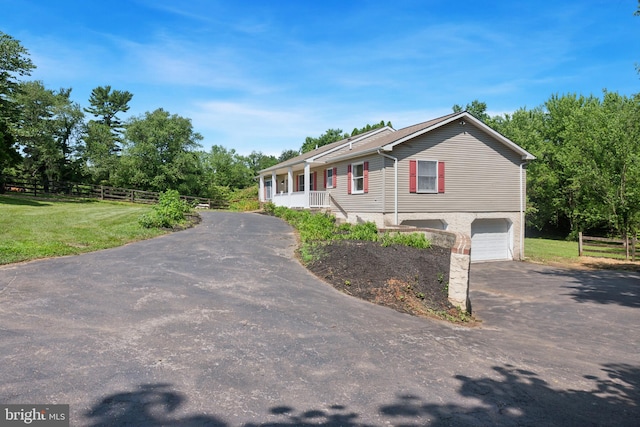 249 Mattson Rd, Garnet Valley, PA 19060 - manufactured / mobile home featuring asphalt driveway and an attached garage