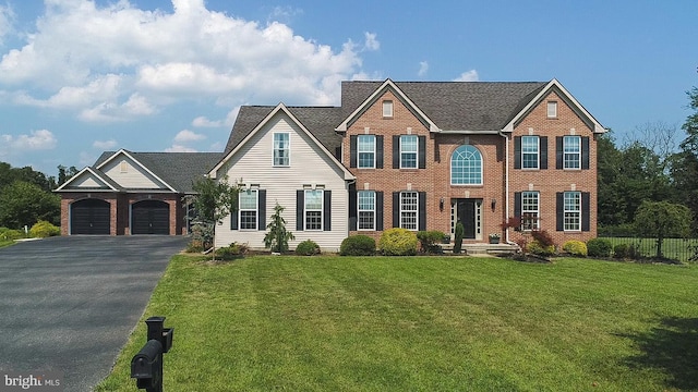 21 Forrest Ct, Woolwich Twp, NJ 08085 - view of front of house featuring asphalt driveway, brick siding, and an attached garage