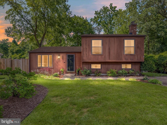 285 Laguna Cir, Severna Park, MD 21146 - tri-level home featuring a chimney and roof with shingles