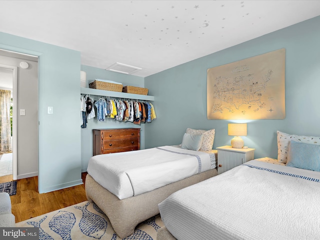 285 Laguna Cir, Severna Park, MD 21146 - bedroom with attic access, wood finished floors, and a closet