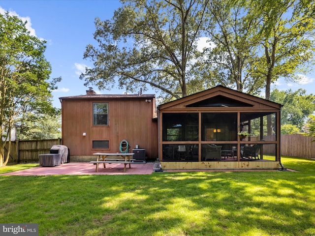 285 Laguna Cir, Severna Park, MD 21146 - rear view of property featuring a sunroom, a patio, and a chimney