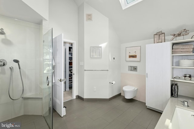 2109 Main St, Bethlehem, PA 18017 - bathroom featuring a skylight, a stall shower, lofted ceiling, a walk in closet, and tile patterned flooring