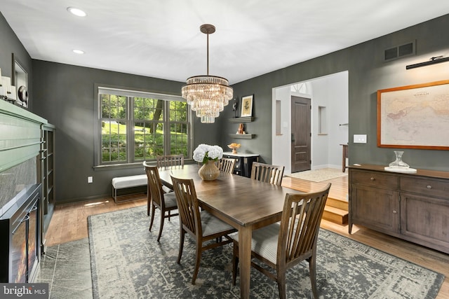 2109 Main St, Bethlehem, PA 18017 - dining room with wood finished floors, a chandelier, a high end fireplace, and recessed lighting