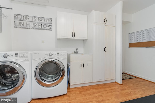 21 Black Bass, Fairfield, PA 17320 - laundry room with washer and clothes dryer, cabinet space, and light wood-type flooring