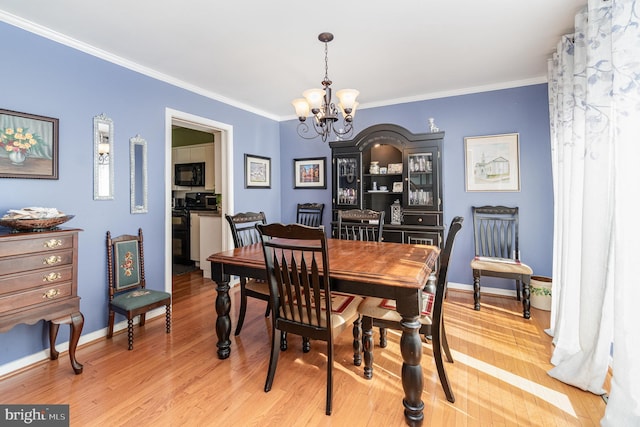 21 Black Bass, Fairfield, PA 17320 - dining room featuring a chandelier, crown molding, and light wood-style flooring