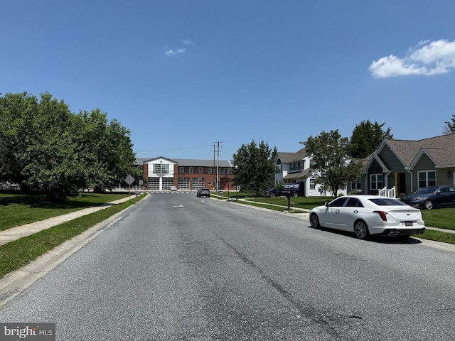 4 Brook Ramble Ln, Townsend, DE 19734 - view of asphalt street featuring sidewalks, curbs, and a residential view