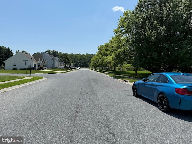 4 Brook Ramble Ln, Townsend, DE 19734 - view of asphalt street featuring sidewalks, curbs, street lighting, and a residential view