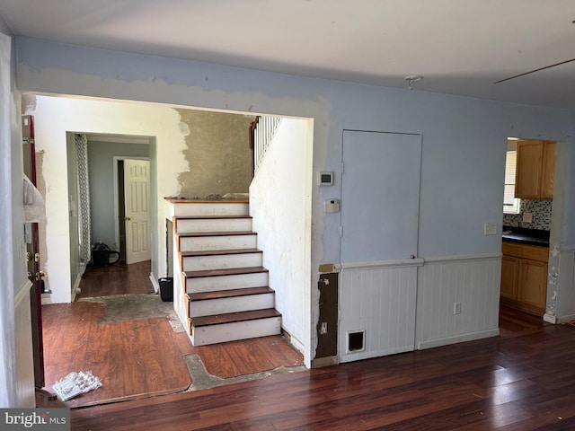4 Brook Ramble Ln, Townsend, DE 19734 - stairway with hardwood / wood-style flooring and a wainscoted wall