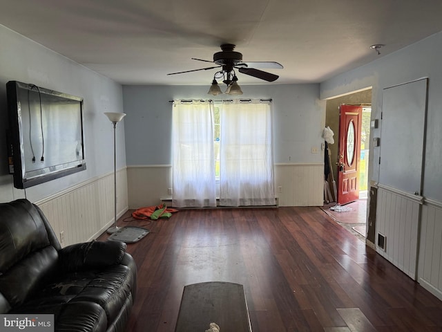 4 Brook Ramble Ln, Townsend, DE 19734 - unfurnished living room with wainscoting, a ceiling fan, hardwood / wood-style flooring, and a baseboard radiator