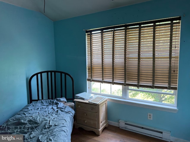 4 Brook Ramble Ln, Townsend, DE 19734 - bedroom with a baseboard radiator, wood finished floors, multiple windows, and vaulted ceiling