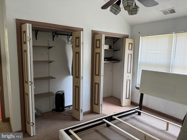 4 Brook Ramble Ln, Townsend, DE 19734 - unfurnished bedroom with lofted ceiling, carpet floors, ceiling fan, and multiple closets