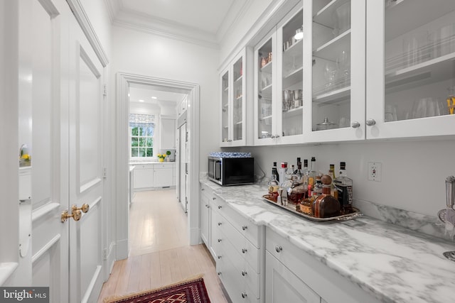 2950 Chain Bridge Rd NW, Washington, DC 20016 - bar area with ornamental molding and light wood finished floors