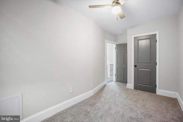 812 N Patterson Park Ave, Baltimore, MD 21205 - unfurnished bedroom with light carpet and ceiling fan