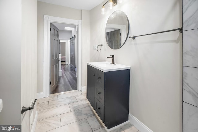 812 N Patterson Park Ave, Baltimore, MD 21205 - bathroom with marble finish floors and vanity