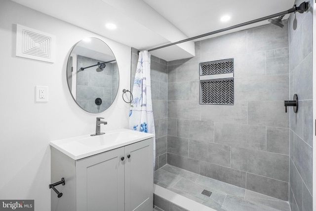812 N Patterson Park Ave, Baltimore, MD 21205 - bathroom featuring vanity, tiled shower, and recessed lighting