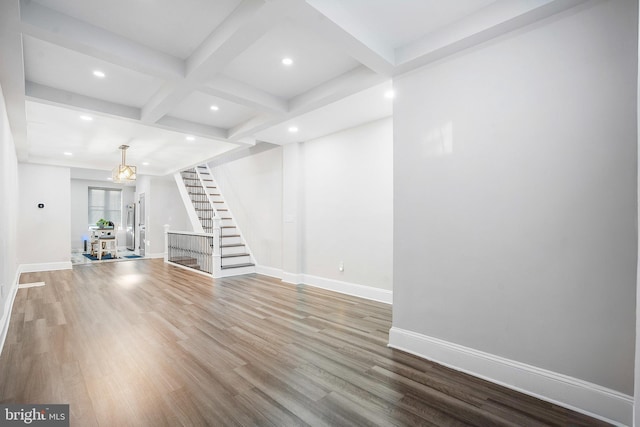 812 N Patterson Park Ave, Baltimore, MD 21205 - unfurnished living room featuring stairs, beam ceiling, wood finished floors, coffered ceiling, and recessed lighting