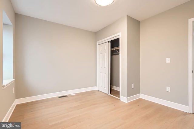3621 Chestnut Ave, Baltimore, MD 21211 - unfurnished bedroom featuring light wood-type flooring and a closet