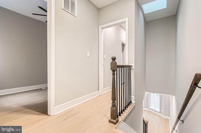 3621 Chestnut Ave, Baltimore, MD 21211 - hallway with an upstairs landing, a skylight, and wood finished floors
