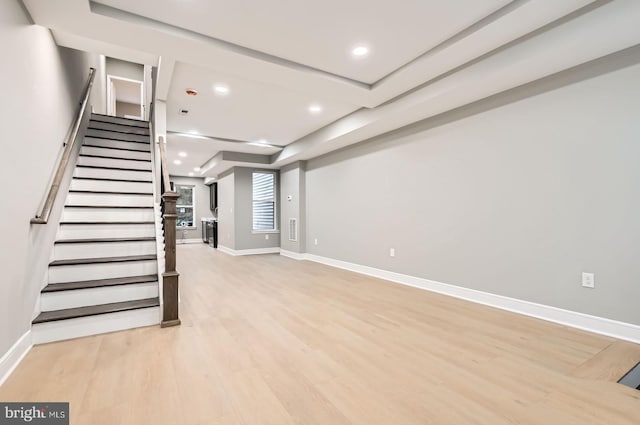 3621 Chestnut Ave, Baltimore, MD 21211 - unfurnished living room featuring recessed lighting, light wood-style flooring, and stairs