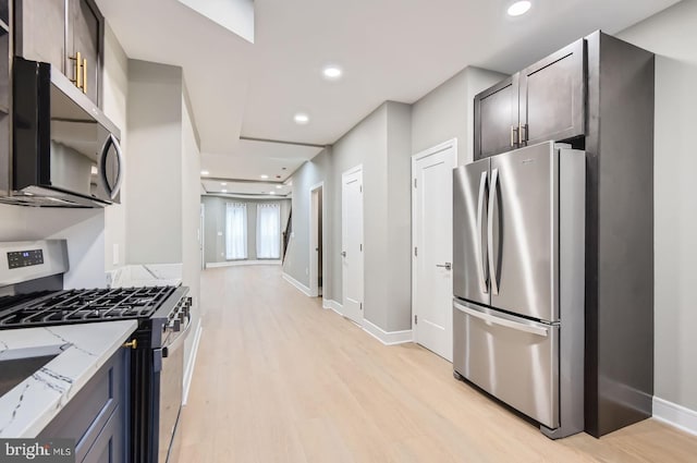3621 Chestnut Ave, Baltimore, MD 21211 - kitchen with stainless steel appliances, light stone countertops, light wood finished floors, and recessed lighting