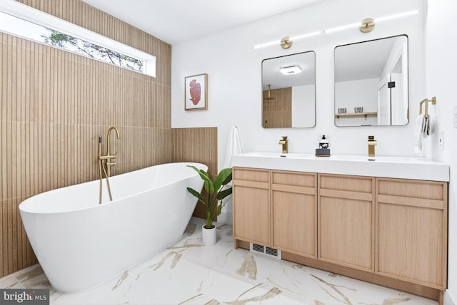 341 Ashford Dr, Lancaster, PA 17601 - full bath featuring double vanity, a soaking tub, marble finish floors, and tile walls