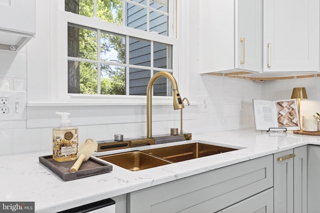 341 Ashford Dr, Lancaster, PA 17601 - kitchen featuring tasteful backsplash, light stone counters, and white cabinetry