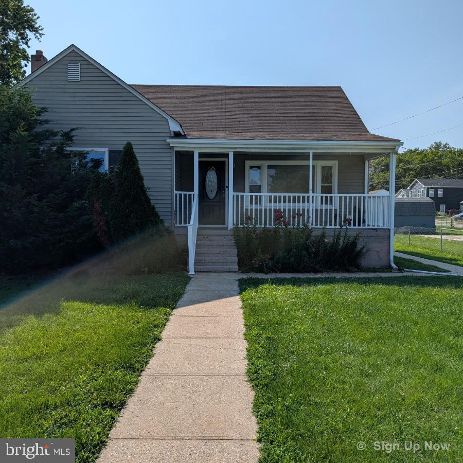 2903 Sparrows Point Rd, Sparrows Point, MD 21219 - view of front of property featuring a porch, a front yard, and roof with shingles