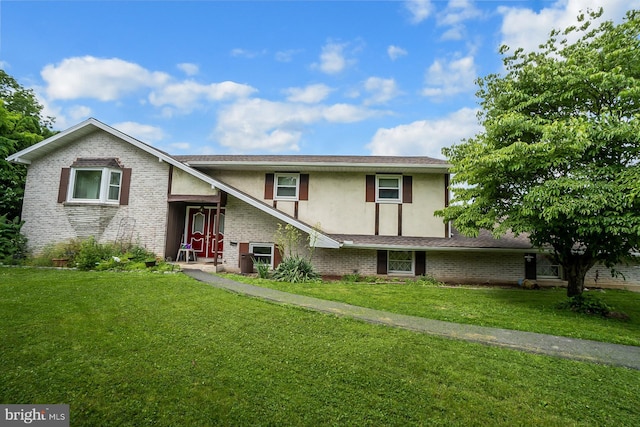 2057 Grove St, Allentown, PA 18104 - view of front of home featuring stucco siding, brick siding, and a front lawn