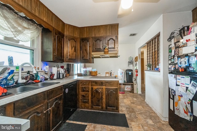 2057 Grove St, Allentown, PA 18104 - kitchen with dishwasher, ceiling fan, light countertops, stone finish flooring, and dark brown cabinetry