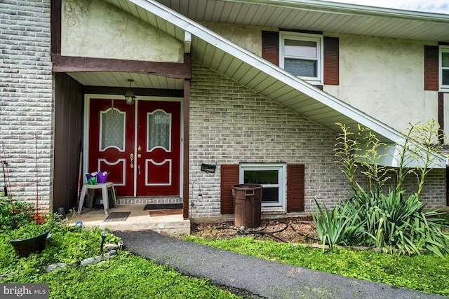 2057 Grove St, Allentown, PA 18104 - view of exterior entry featuring brick siding and stucco siding