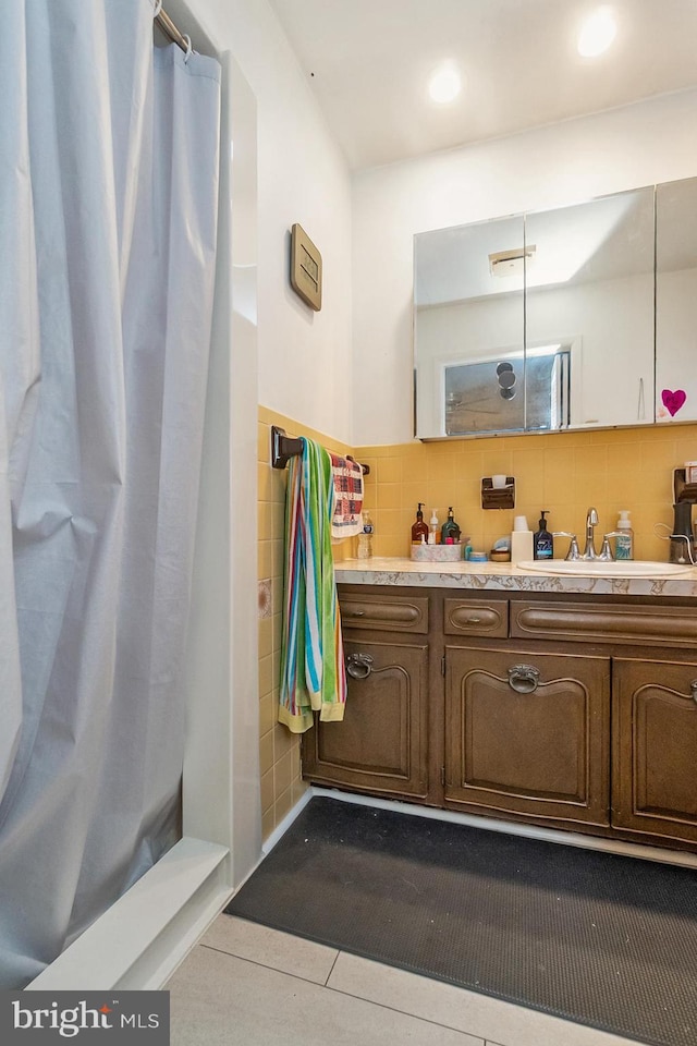 2057 Grove St, Allentown, PA 18104 - full bathroom with tile walls, vanity, a shower with shower curtain, tile patterned flooring, and recessed lighting